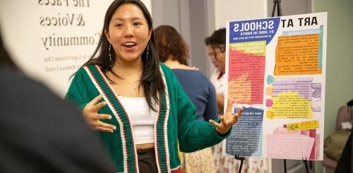 a student presents her poster at the CASA presentation night